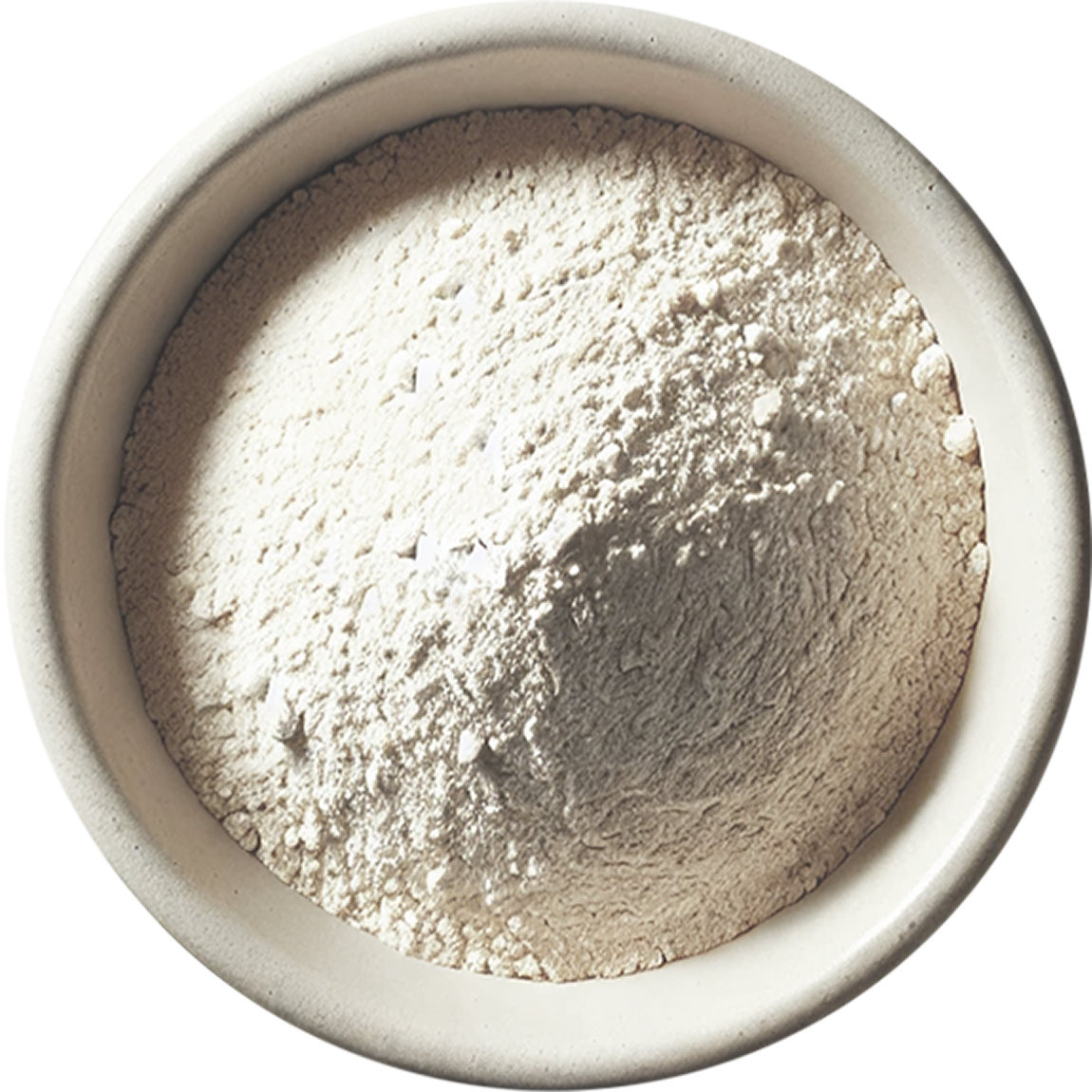 Mound of flour in white ceramic bowl. 